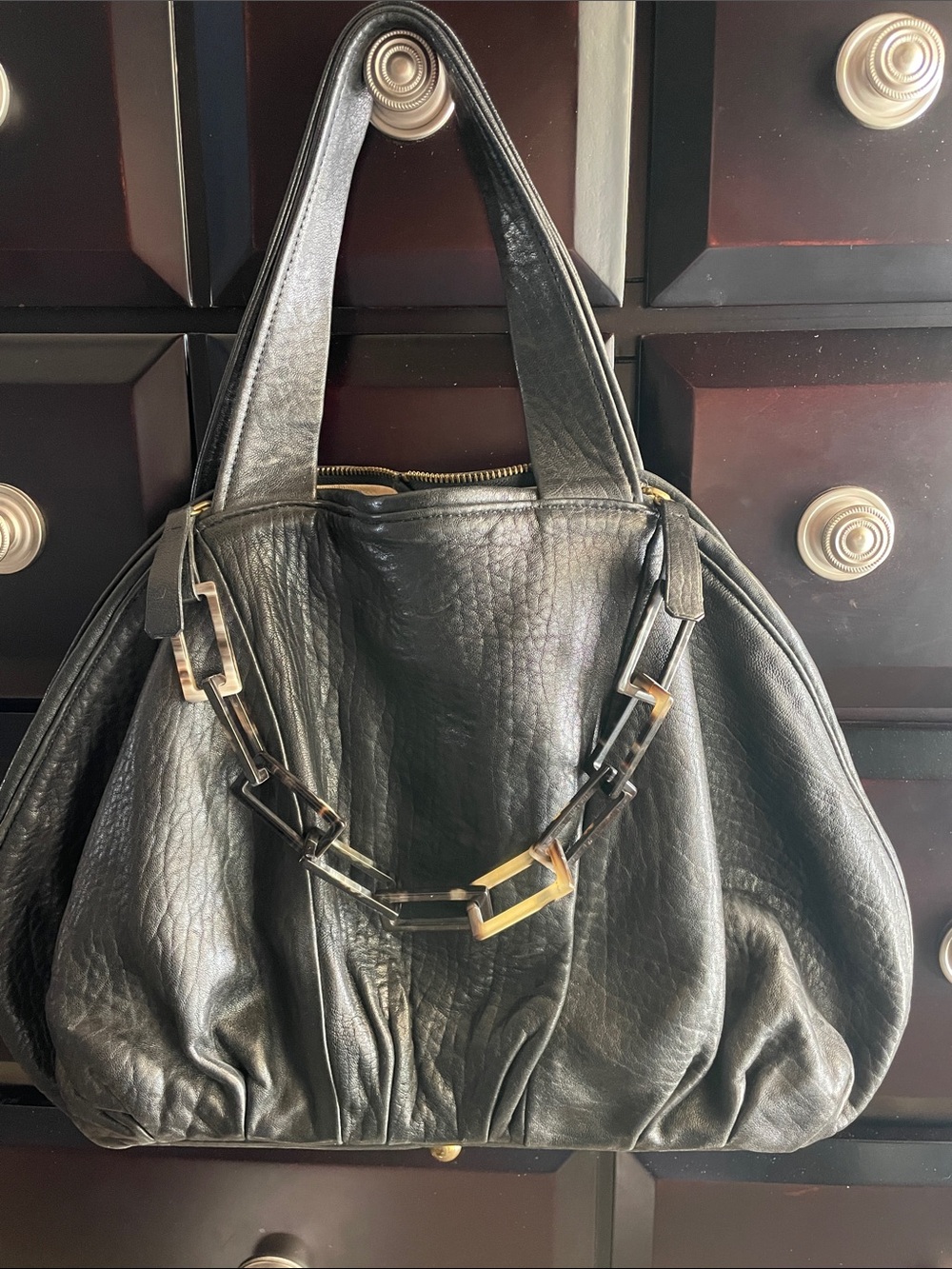 Black Leather Shoulder Bag with Geometric tortoise Chain Detail